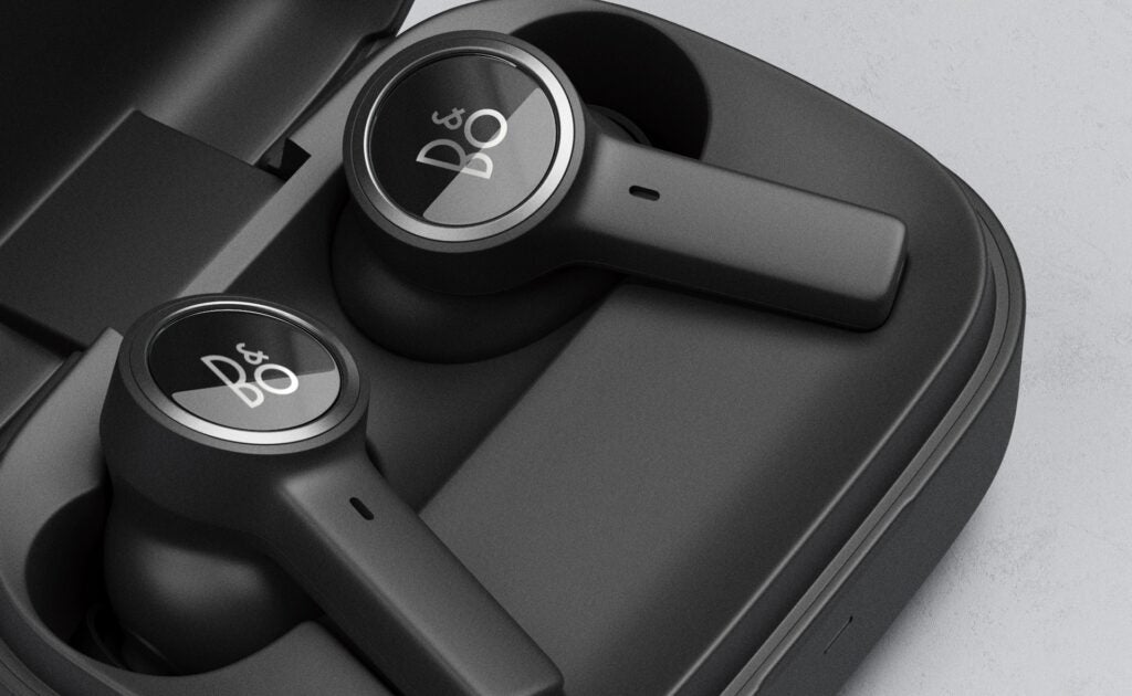 B&O Beoplay EX earphones seated in a case