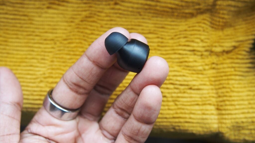 JLab Go Air Pop earphone held in hand