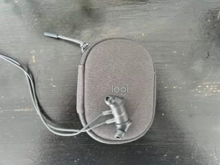 Logitech Zone Wired earbuds on the Logi Pouch