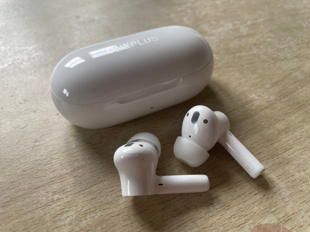 OnePlus Buds Z2 earphones sat right next to case