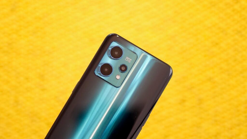 Realme 9 Pro Plus camera module shown off before a yellow background