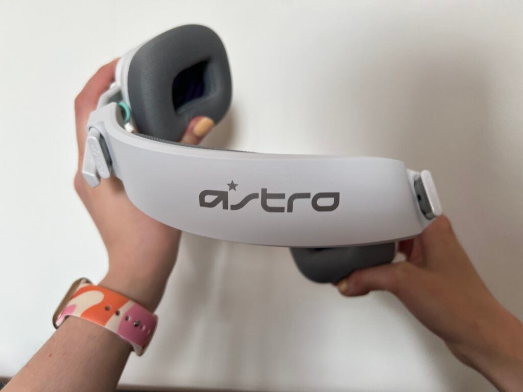 Showing the flexibility of the Astro A10 Gen 2 headset against a white wall