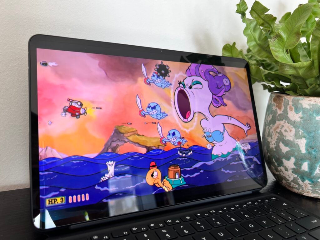 The MateBook E playing Cuphead to show off the bold colours