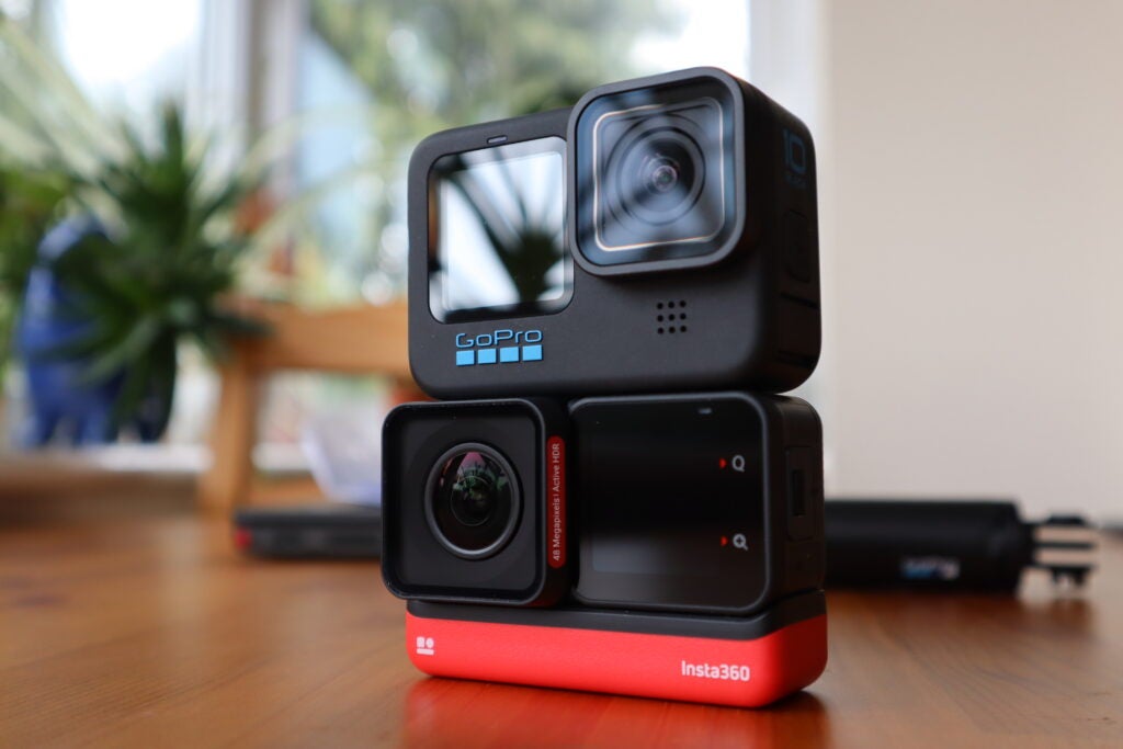 The GoPro Hero 10 Black sat on top of the Insta360 One RS