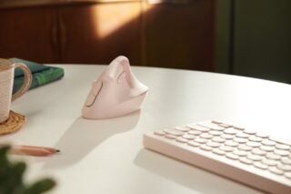 The Logitech Left in Rose on a desk in a press shoot