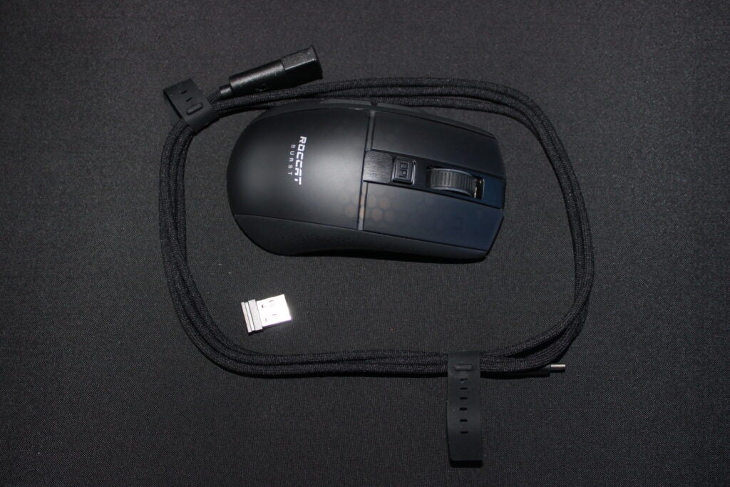 Roccat Burst Pro Air gaming mouse with USB-C cable and dongle.