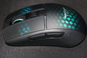 Roccat Burst Pro Air gaming mouse on a fabric surface.