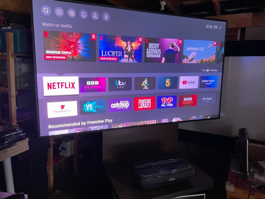 Hisense 100L9GTUK Laser TV displaying smart interface with apps.