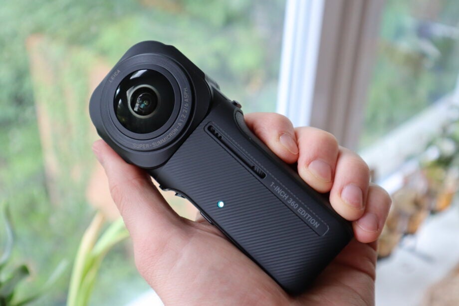 The Insta360 One RS 1-inch 360 Edition being held in a hand