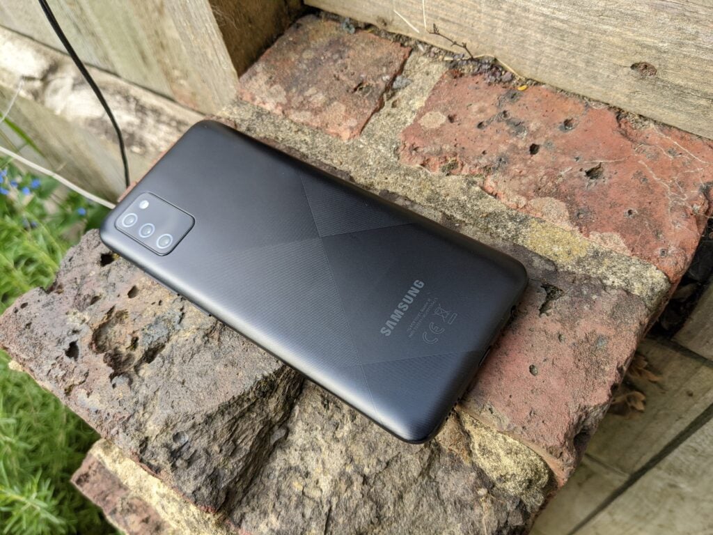 Samsung Galaxy A02s rear panel on brick
