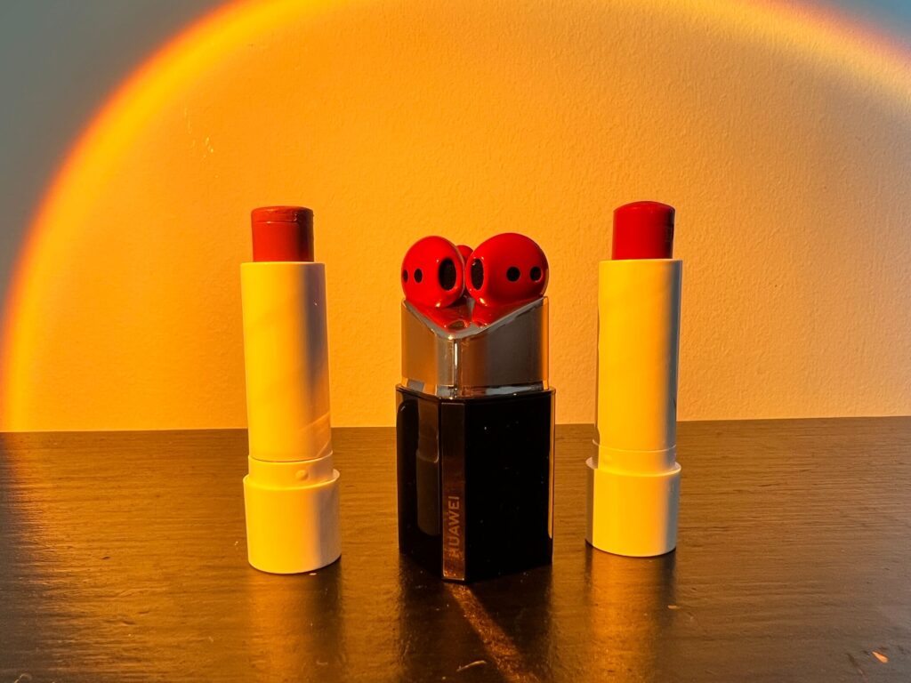 The FreeBuds Lipstick next to two similar lipstick shades