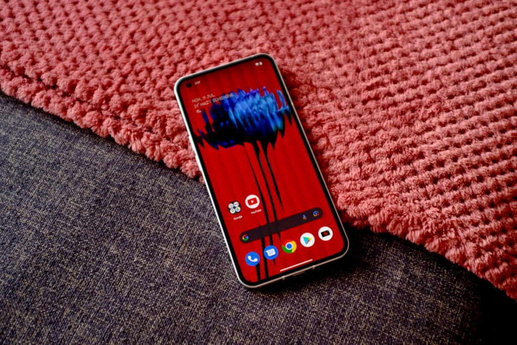 The Nothing Phone 1 with a red background