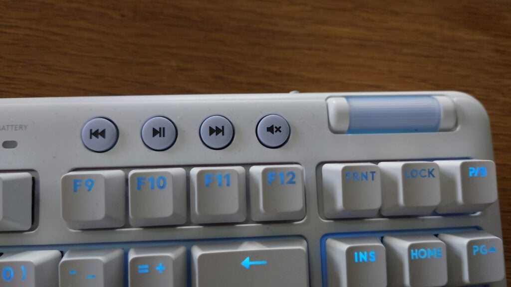 Close-up of Logitech G715 keyboard media control keys.