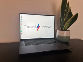 The Huawei MateBook 16s on a desk next to a plant
