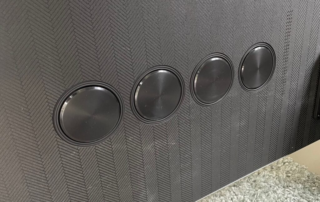 Detail shot of some of the speakers on the Samsung QE75QN900B's rear.