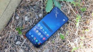 Poco X4 GT smartphone lying on outdoor ground