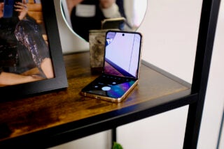 Samsung Galaxy Z Flip 4 phone open on desk