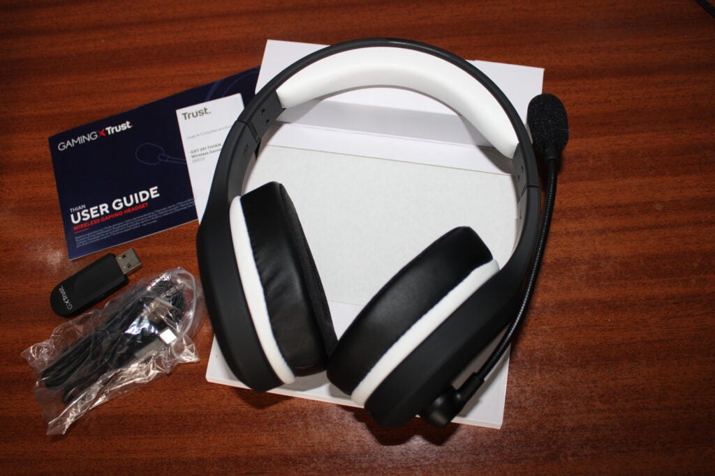 The Trust Gaming headset in its box with the bundled accessories. 