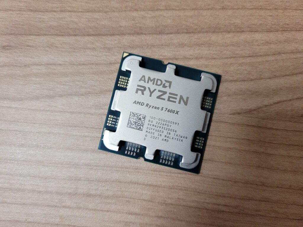 The AMD Ryzen 5 7600X chip on a desk