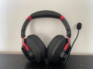 The PG16 headset leaning against a white wall