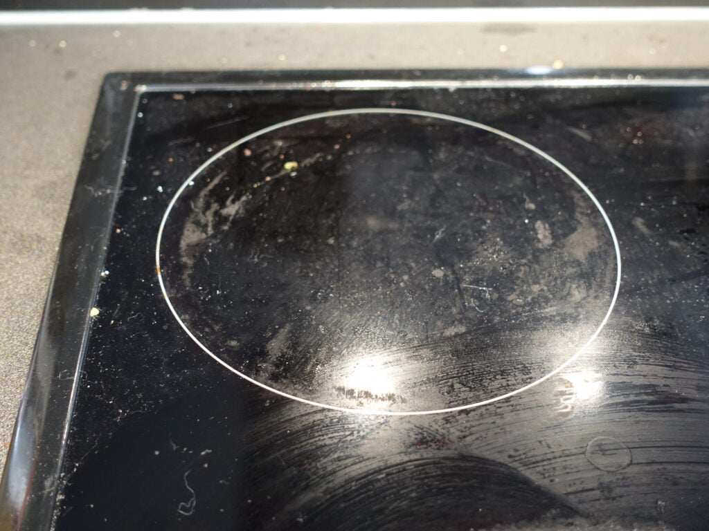 Ceramic hob before being cleaned with the Swan Lynsey handheld steam cleaner