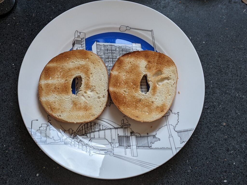 A browned bagel, cut in half and toasted with the Cuisinart Signature Collection 4 Slice Toaster