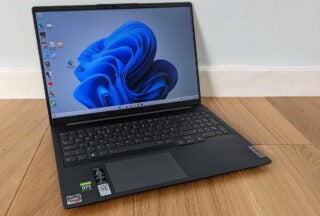 Lenovo Ideapad 5 Pro 16 laptop on wooden surface.