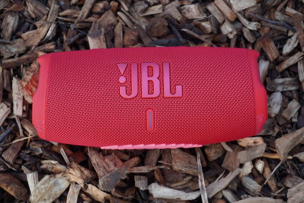 JBL Charge 5 on wood chippings