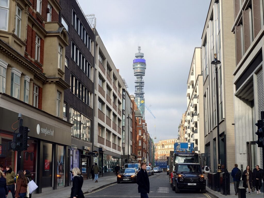 Urban street scene with the iconic BT Tower in the background.
