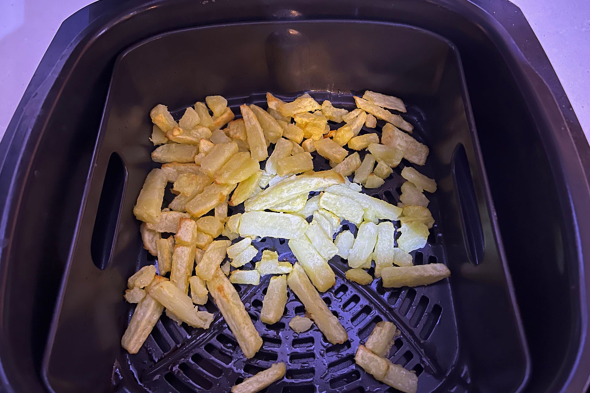 Shake the chips in the air fryer