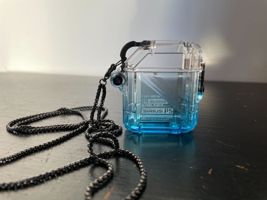 The metal necklace attached to the Sirius P5's Defence Crystal case