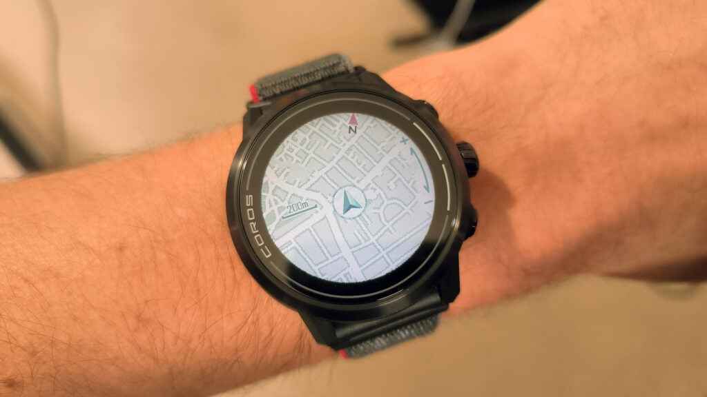 The Coros Apex 2 on a wrist, with the screen showing a map