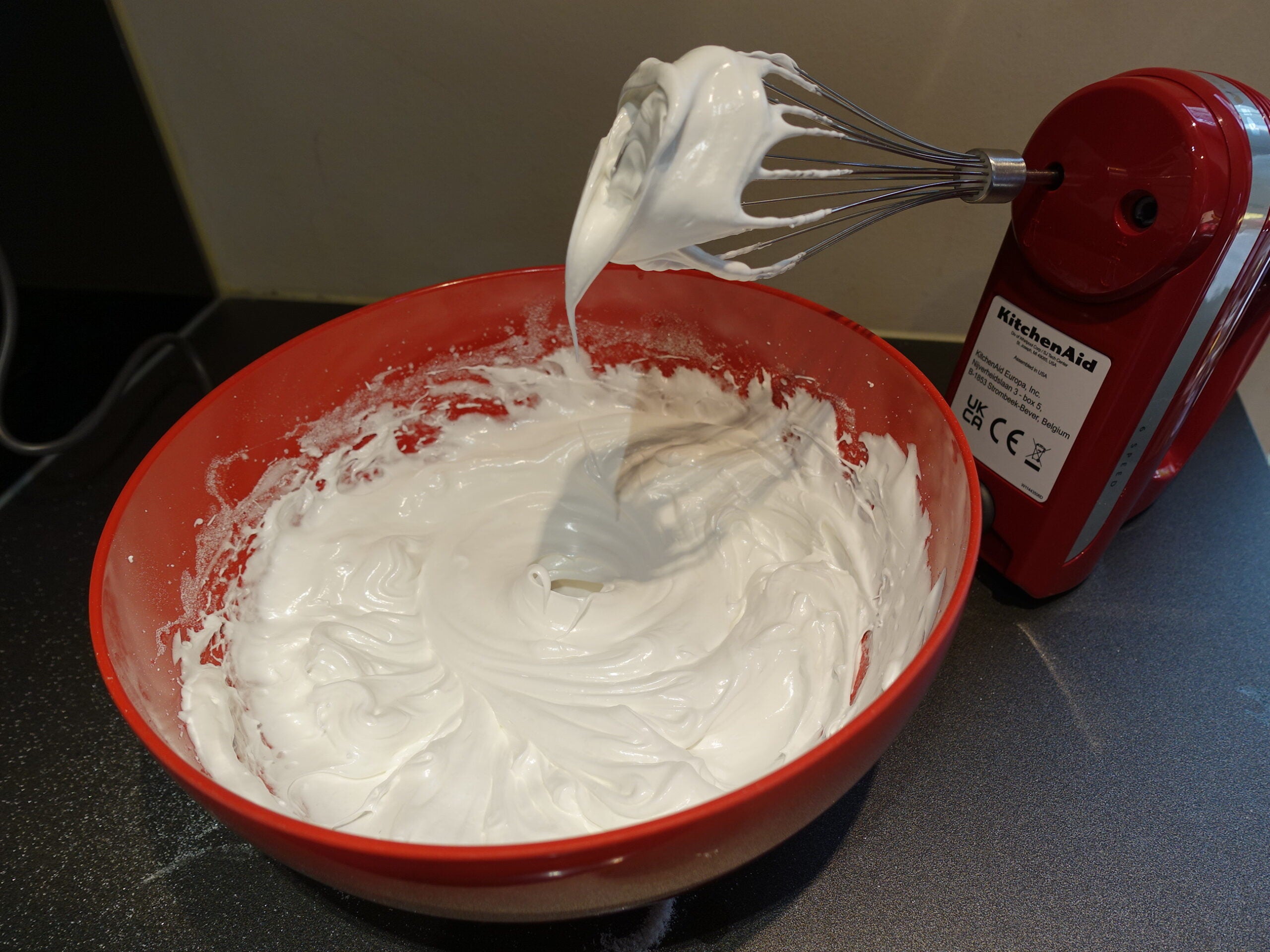 KitchenAid 6 Speed Hand Mixer with Flex Edge Beaters whipping egg whites