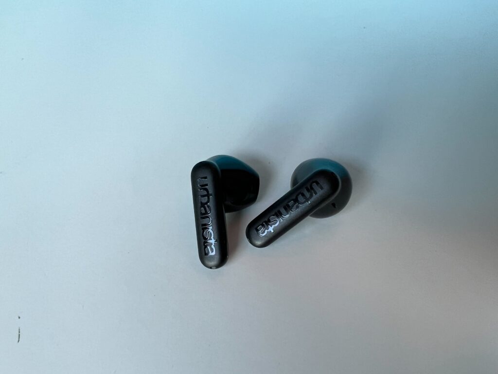 The individual Urbanista Copenhagen earbuds on a table