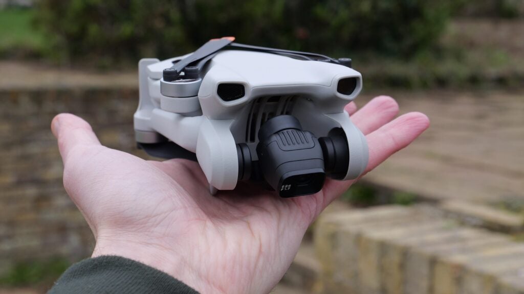 The DJI Mini 3 folded up in the hand