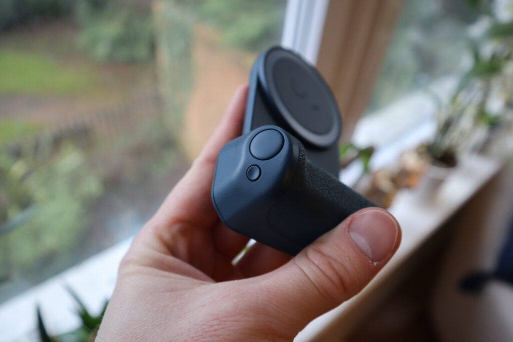 There are two buttons on the ShfitCam SnapGrip, a physical shutter button and a MagSafe charger button