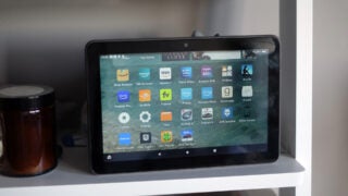 Amazon Fire HD 8 Plus tablet on a shelf displaying apps.