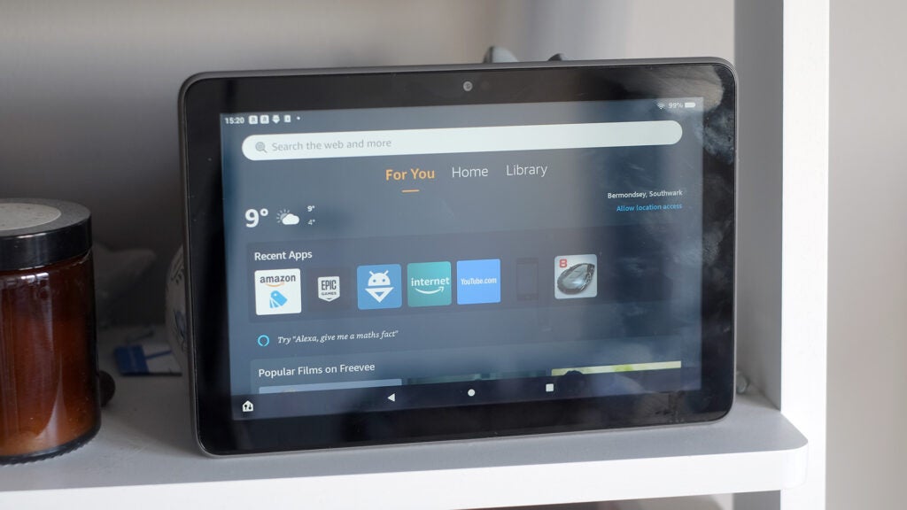 Amazon Fire HD 8 Plus tablet on shelf displaying apps.