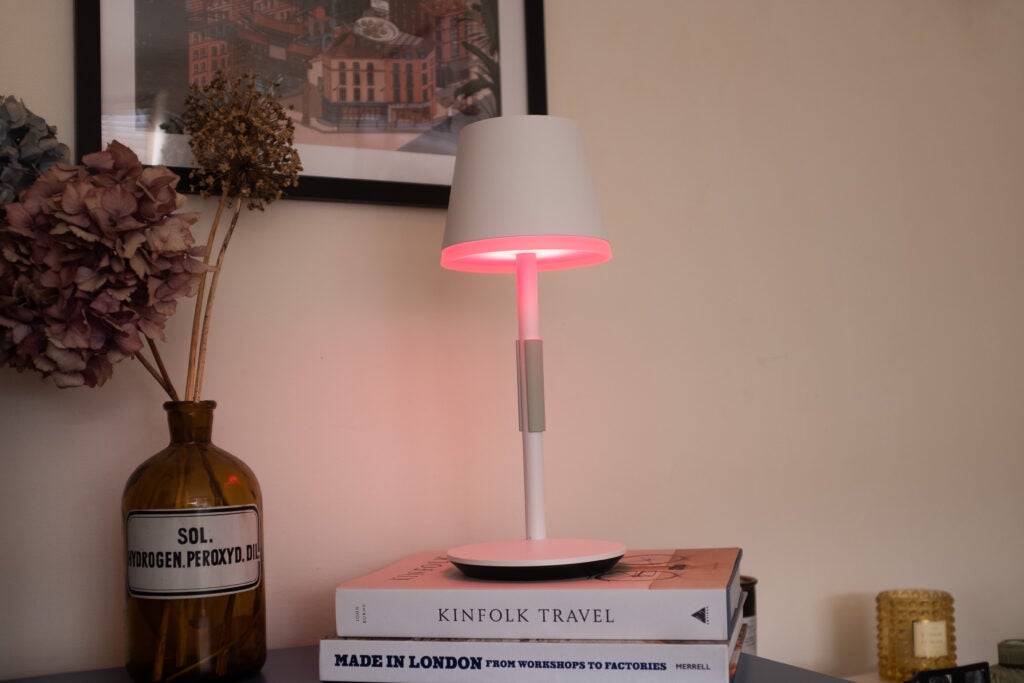 Hue Go Table Lamp with a red light on