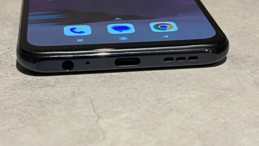 Xiaomi Redmi Note 10S showing bottom ports and front display.
