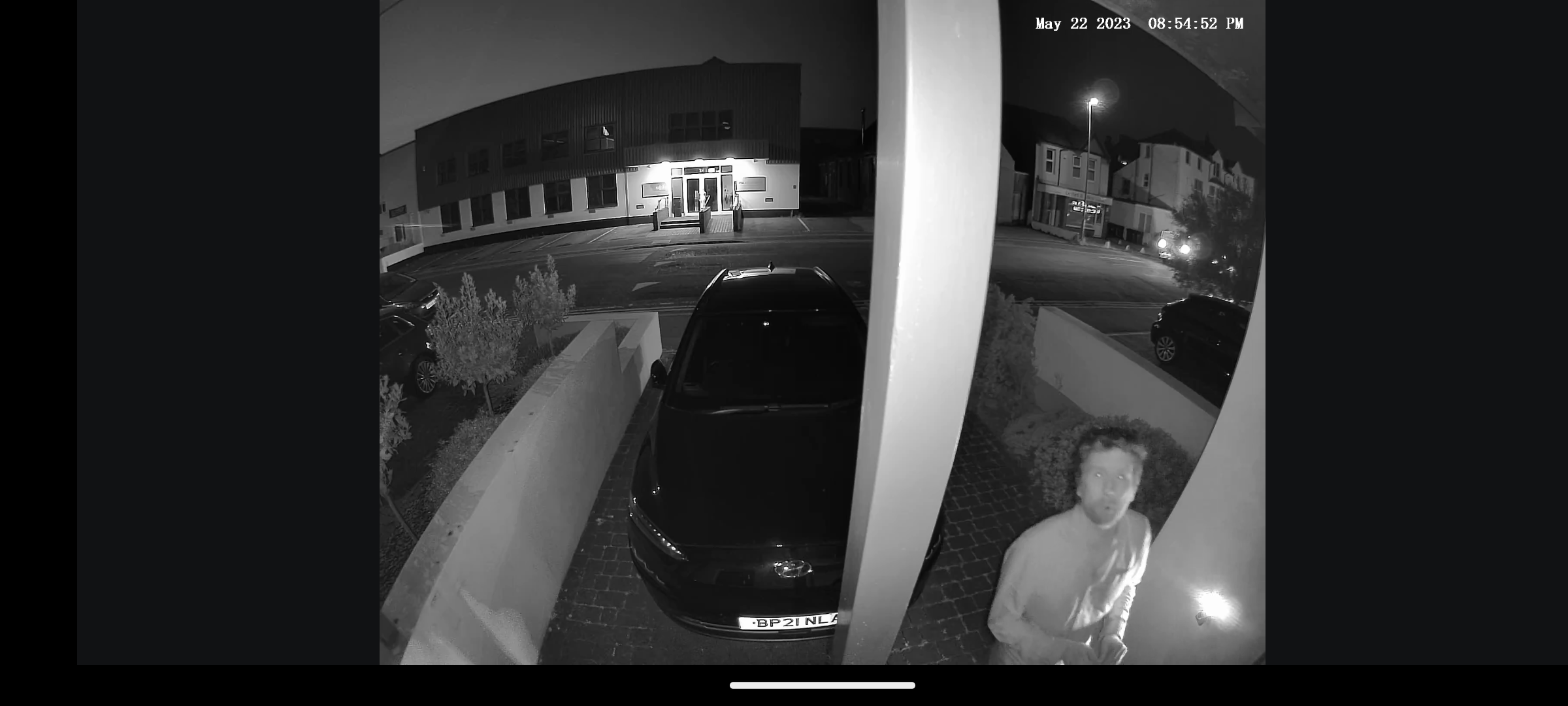Left ImageNighttime surveillance footage from Eufy security camera.Eufy S100 camera night view capturing a person outdoors.