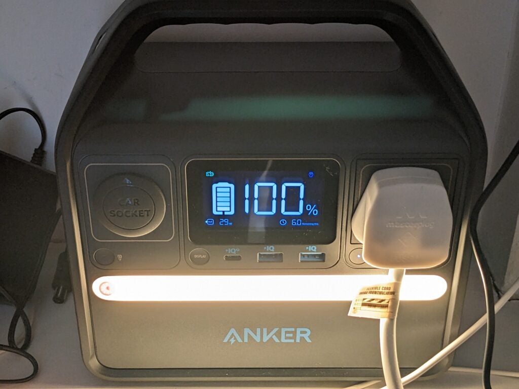 Anker PowerHouse 521 From the front with a plug inserted.