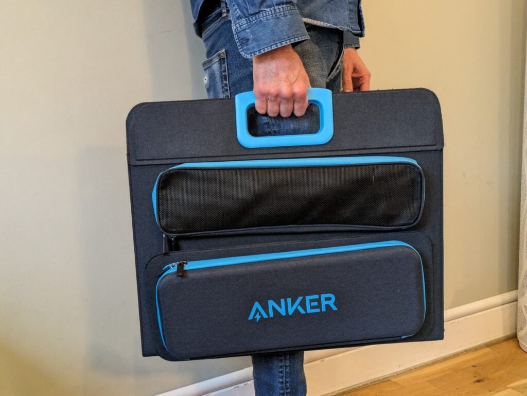 Anker PowerHouse 521 Solar Panel being carried around.