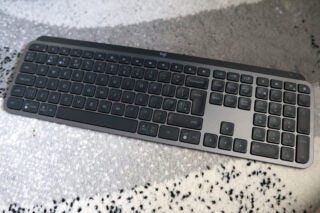 Logitech MX Keys S keyboard on a patterned carpet.