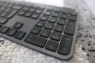 Close-up of Logitech MX Keys S keyboard on a desk.