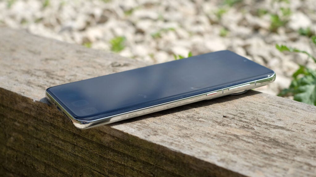 Huawei P60 Pro laying on a piece of wood