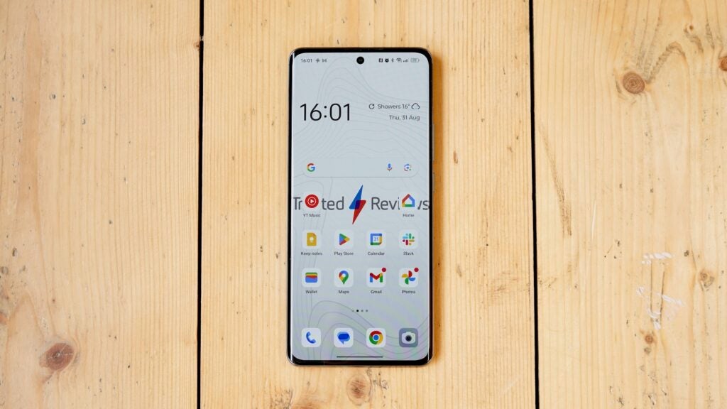 Oppo Reno 10 5G on a wooden surface