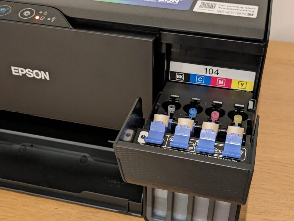 Ink tank lids opened at the right of the printer