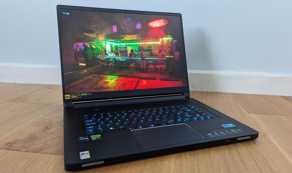 Acer Predator Triton gaming laptop with a game on screen.