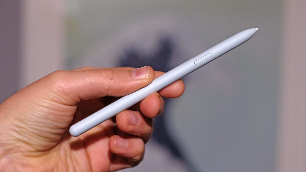 Samsung Galaxy Tab S9 FE's S-Pen in hand